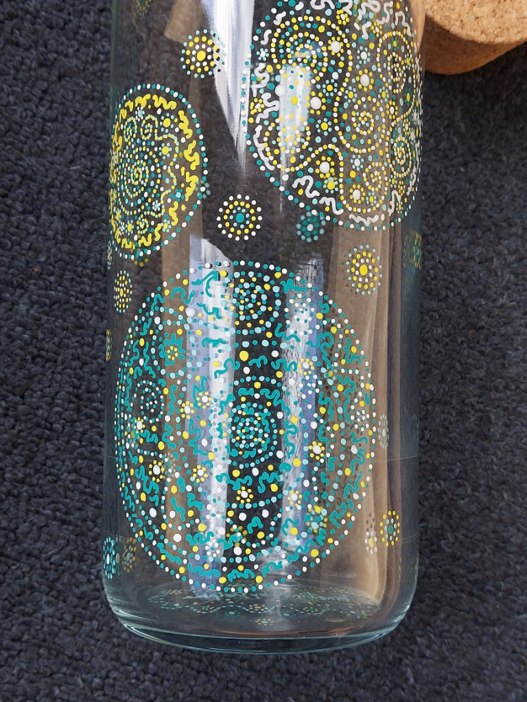 PURPOSE - Glass water bottel 1 ltr, handpainted dots Light Language Codes teal blue, yellow, white